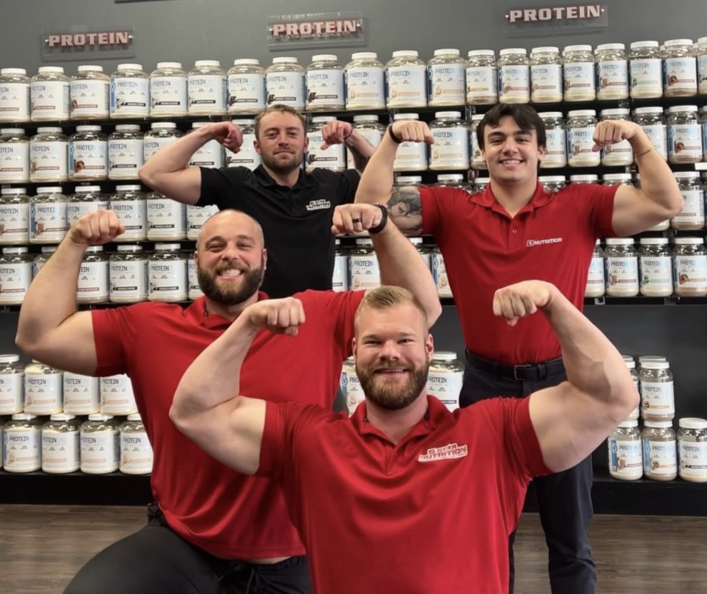 5 Star team members flexing in a group at one of the retail stores