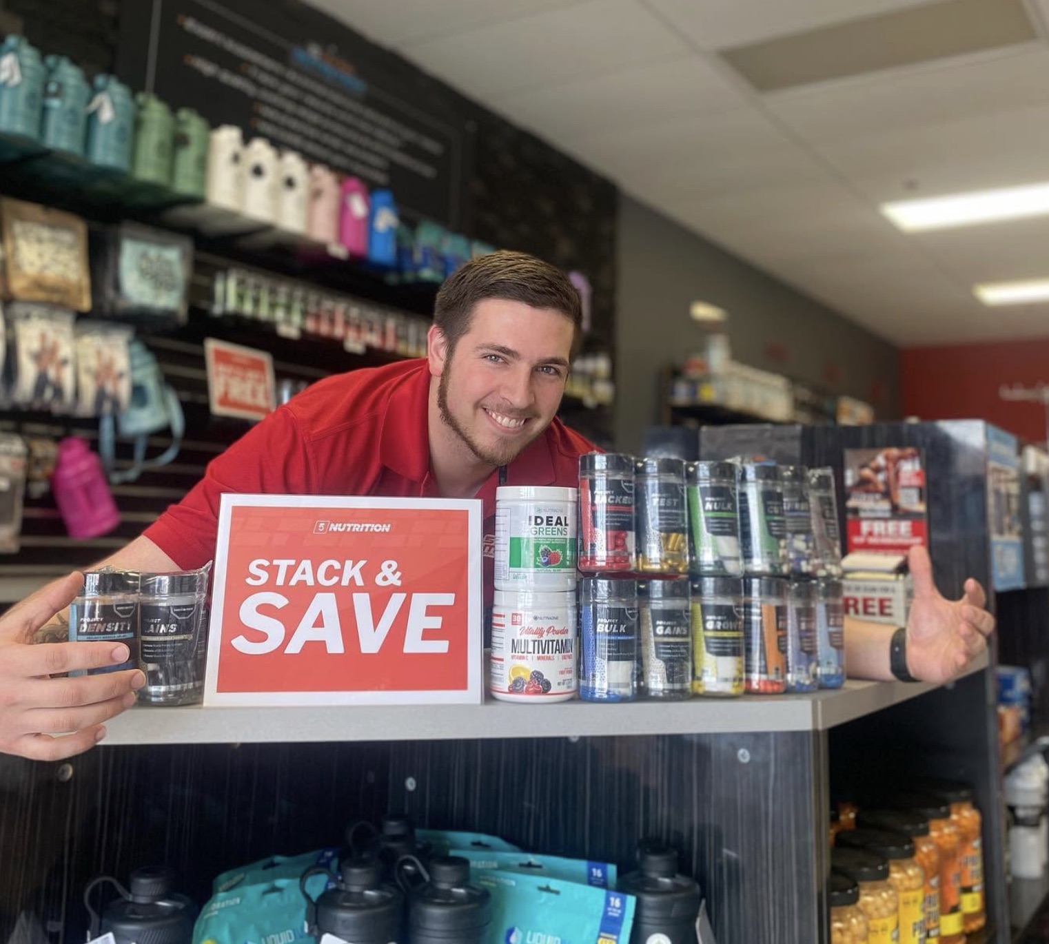 5 Star employee posing with products