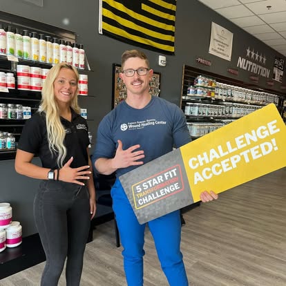 5 Star employee posing with a customer