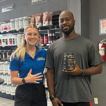 5 Star employee posing with a customer